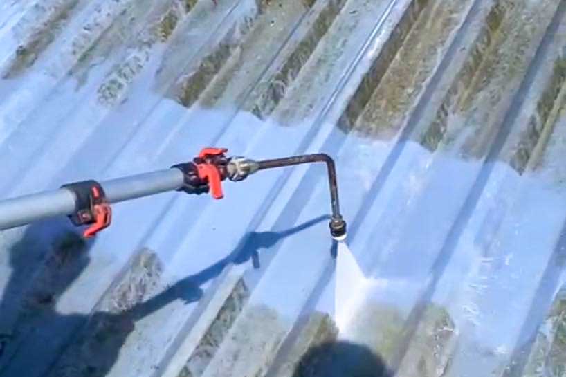 Using a power hose to professionally wash a shed roof in Athlone